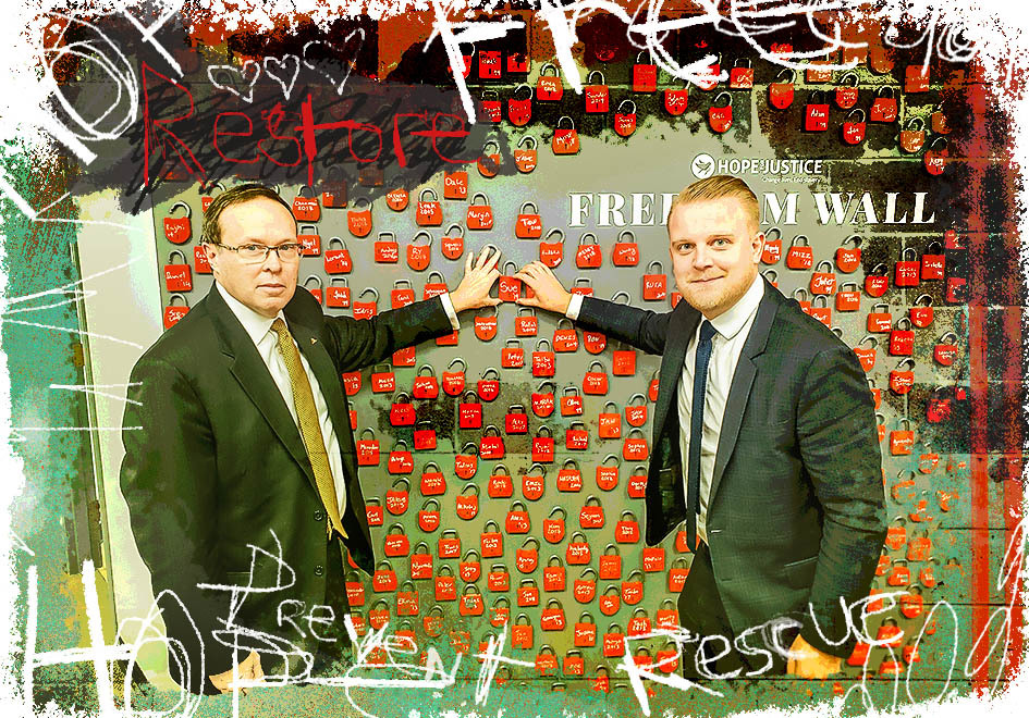 two businessmen standing and looking at camera