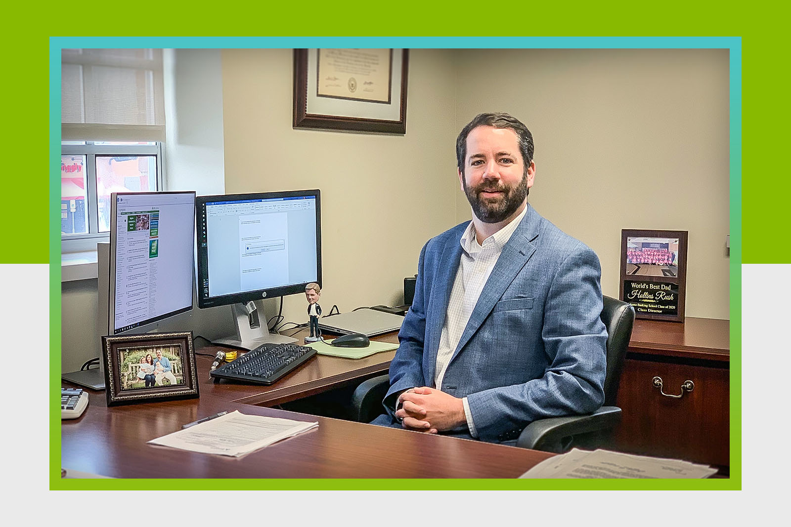 business man seated and looking at camera