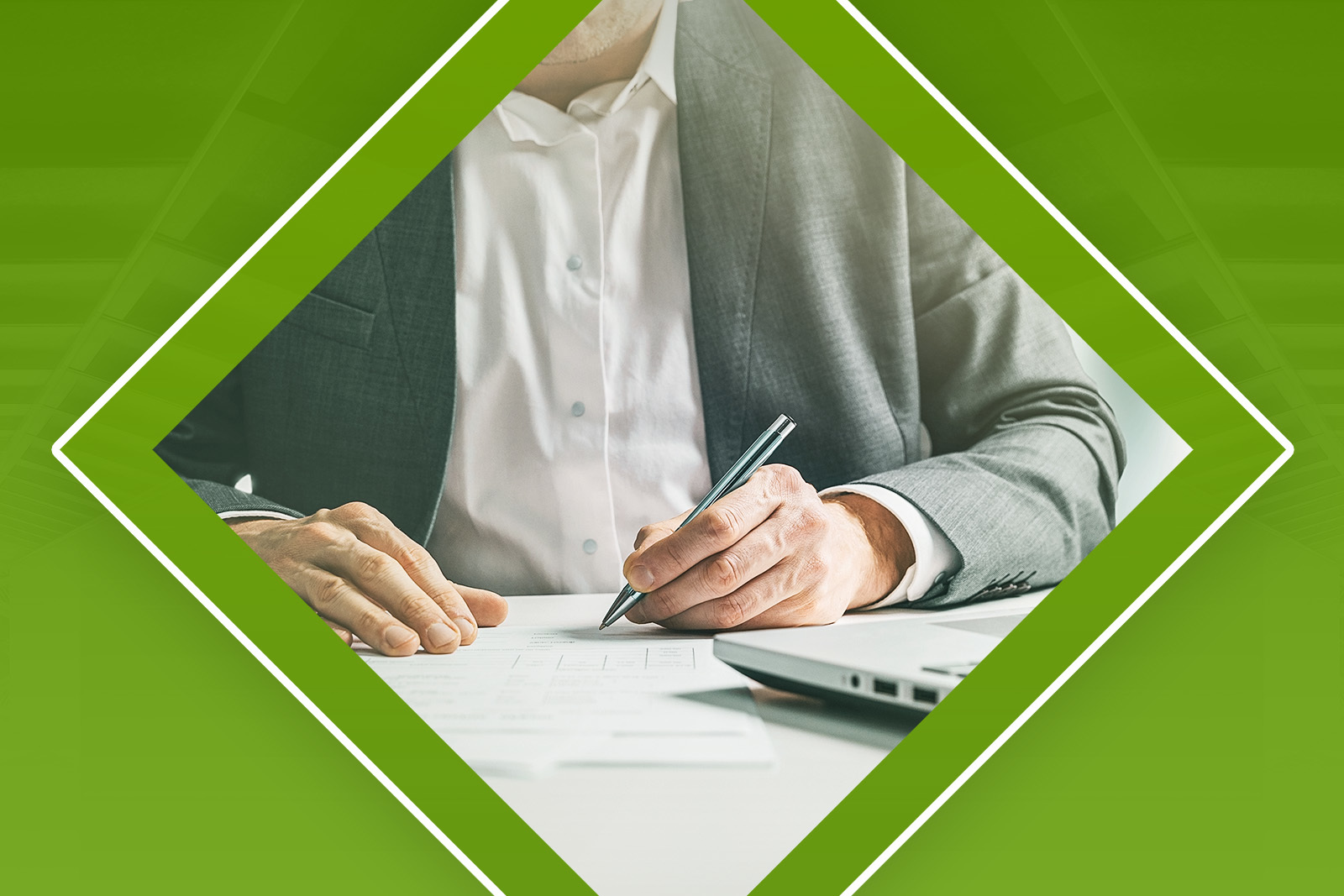 image of man signing a document
