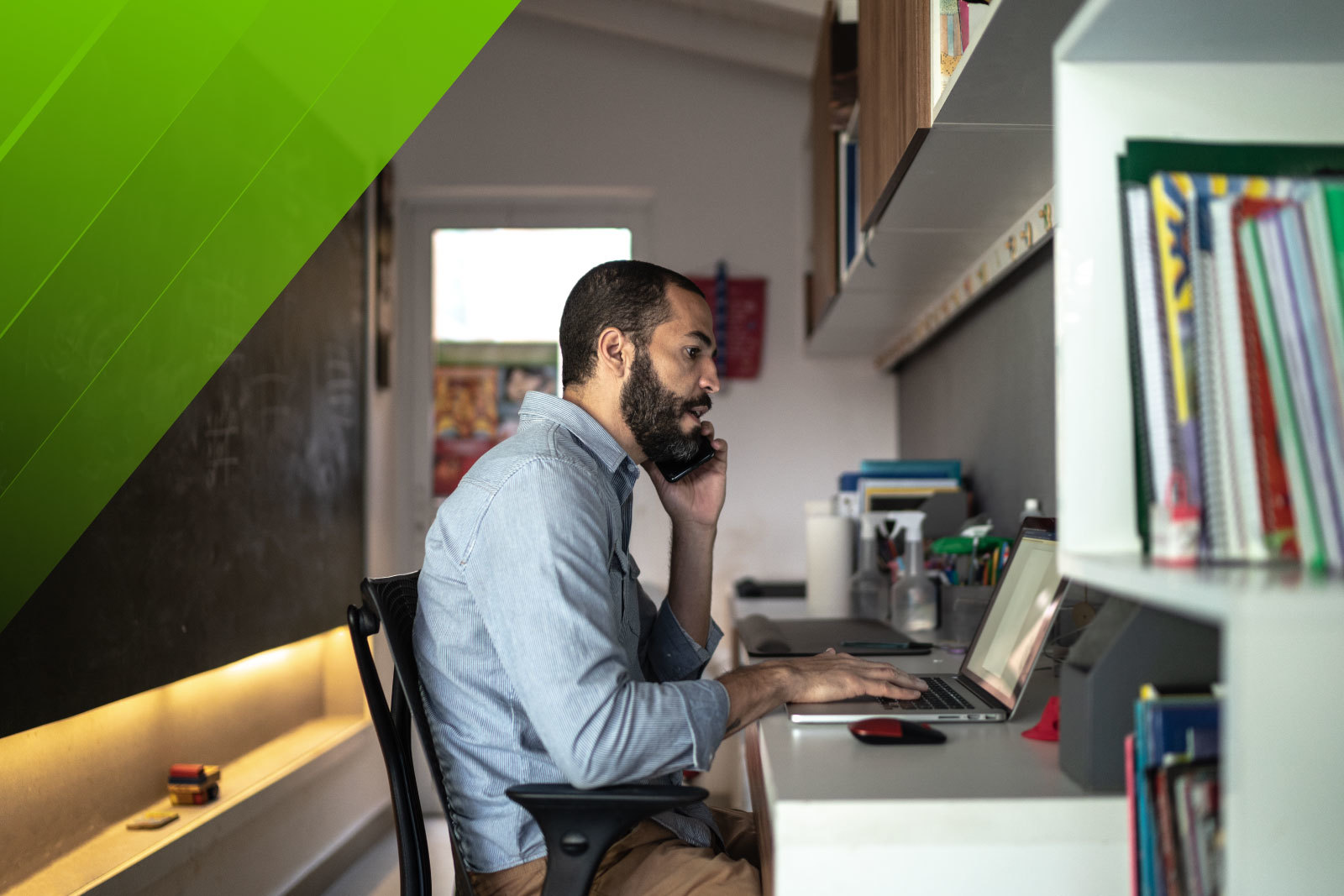 man at desk looking at computer