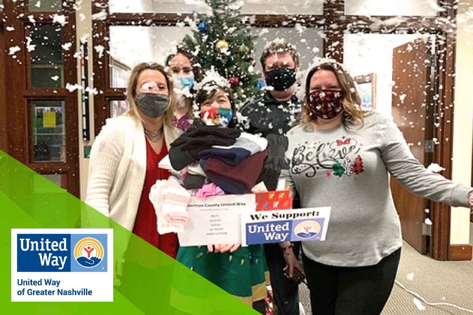 associates holding donated supplies