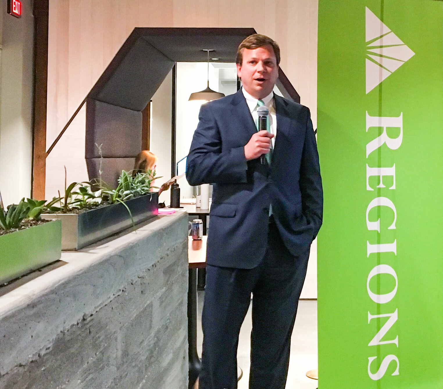 Photo of Graham Ralston, speaking into a microphone