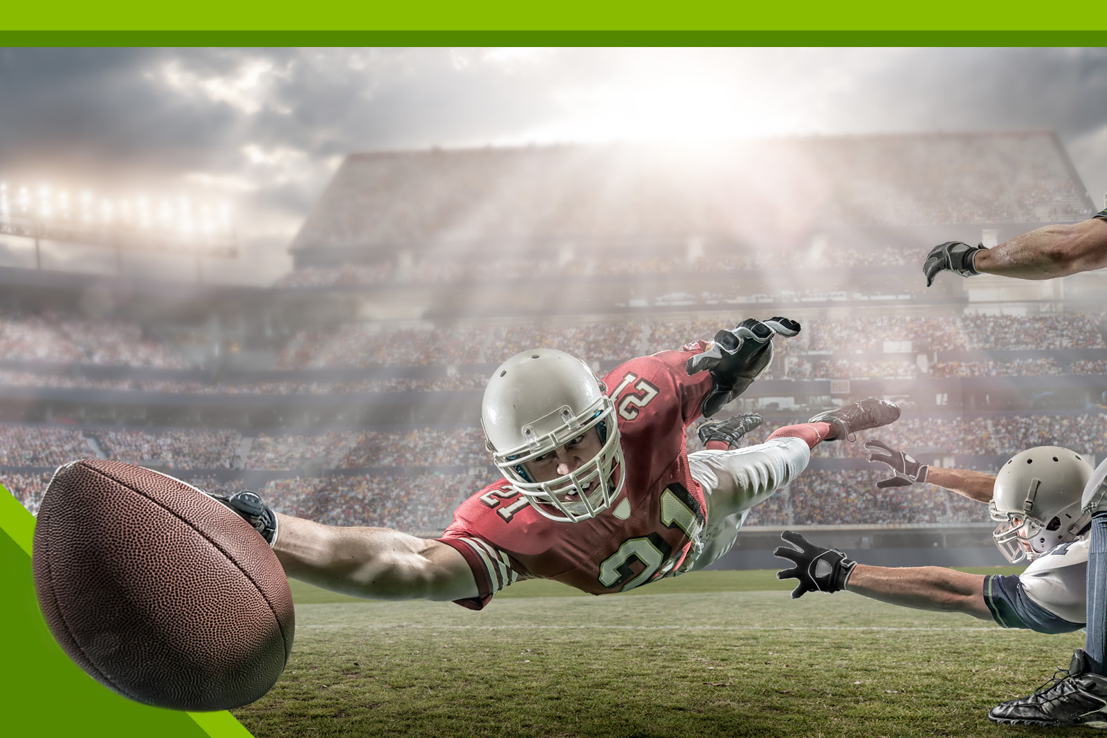 football player diving with ball