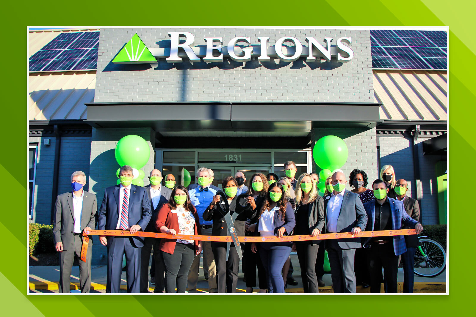bankers standing outside new bank branch