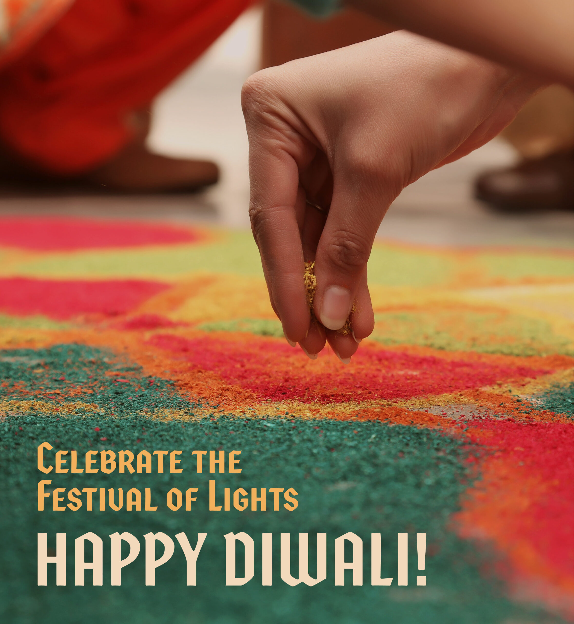 Hand dropping sand to create rangoli. Text: Celebrate the Festival of Lights. Happy Diwali.