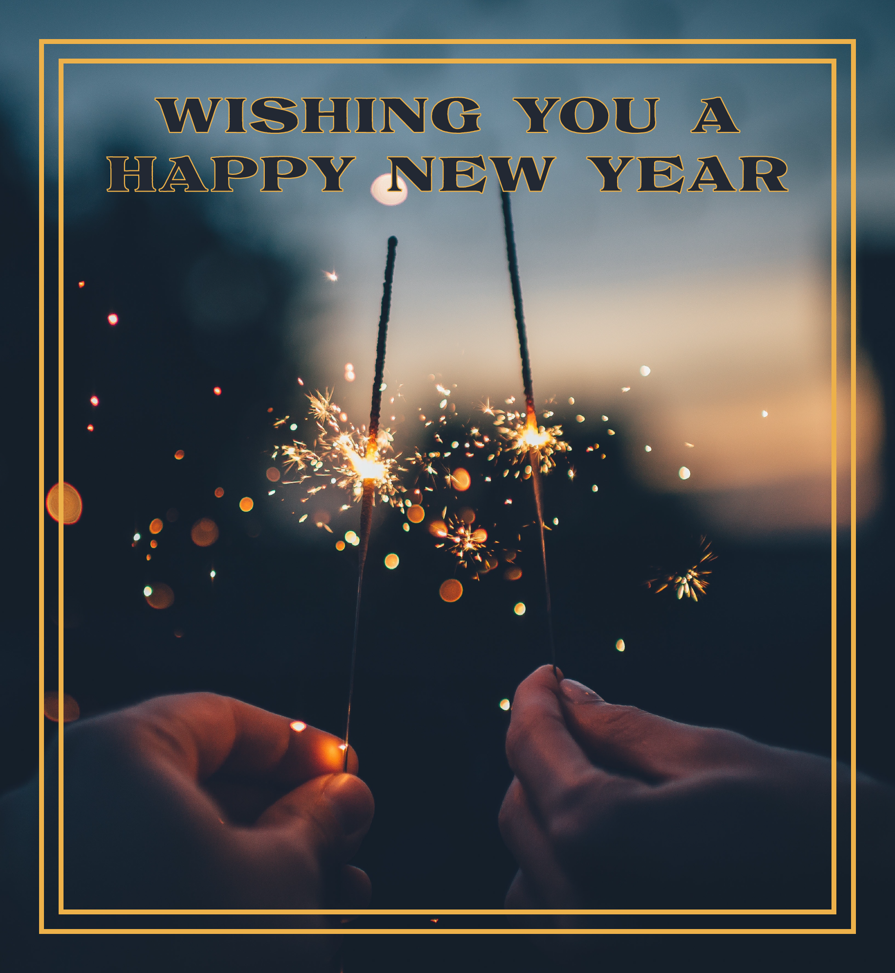 Two hands holding sparklers. Text: Wishing you a Happy New Year.