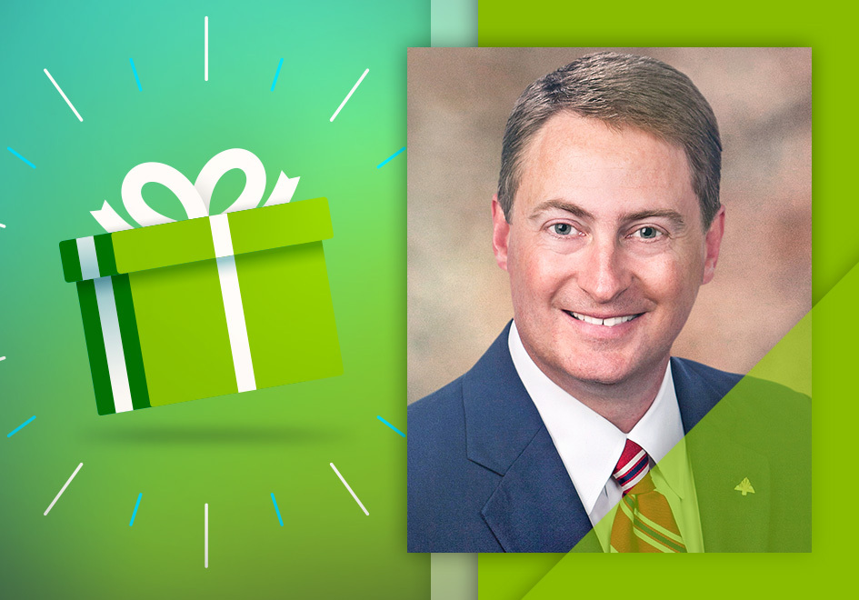 Gift box next to portrait of Robert Leard