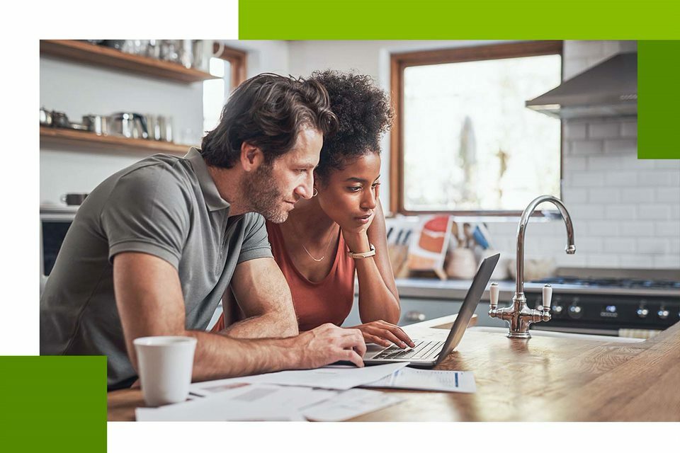 Two people looking at laptop