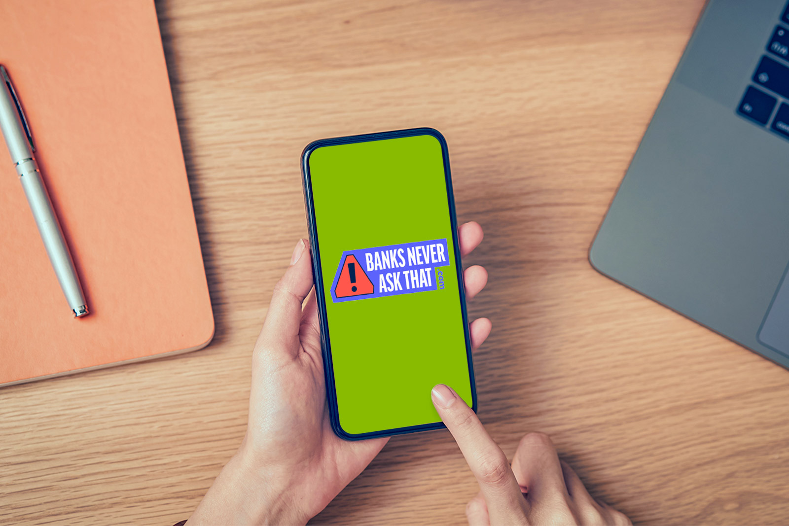 closeup of someone holding a phone on desk. screen of...