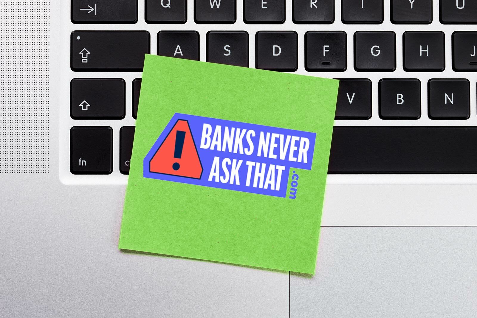 closeup of computer keyboard with stick note. stick note has...