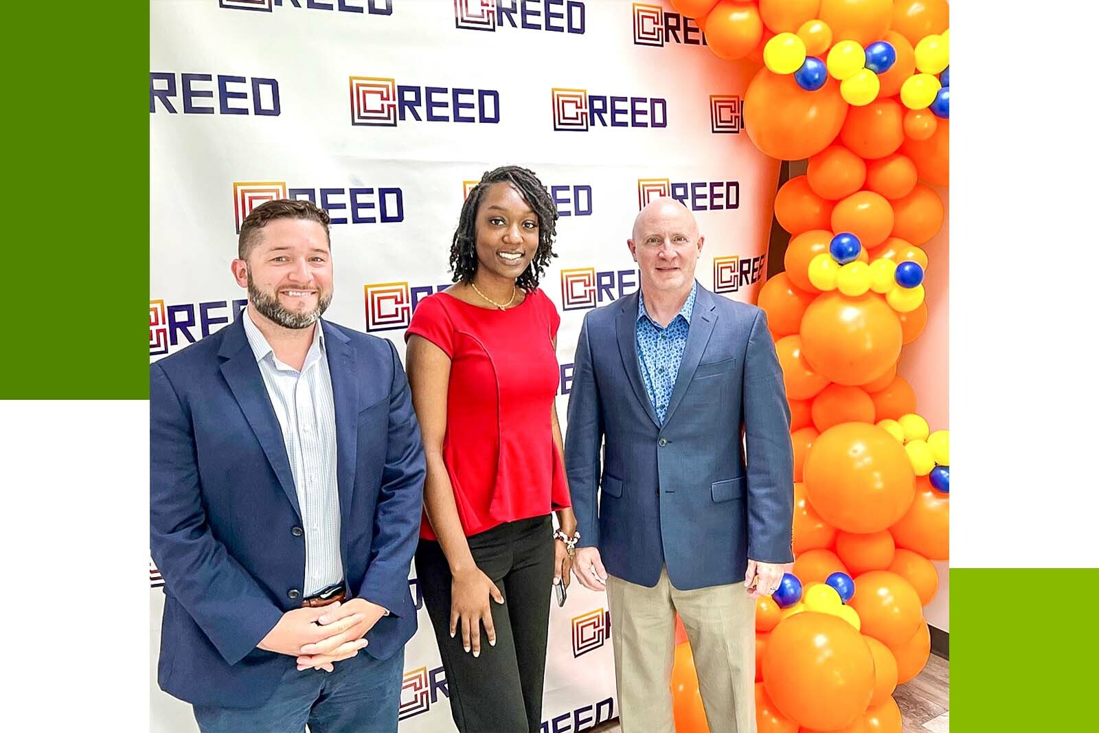 three people smiling at camera
