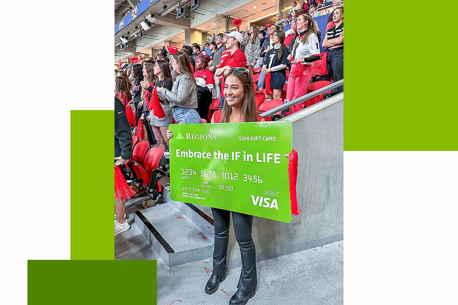 woman holding a sign at a college football game