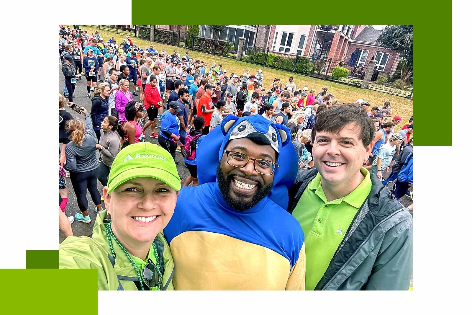 three people smiling at camera