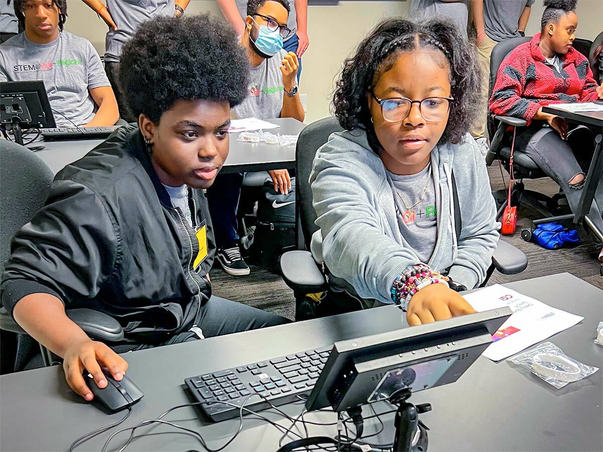 students working with computer equipment