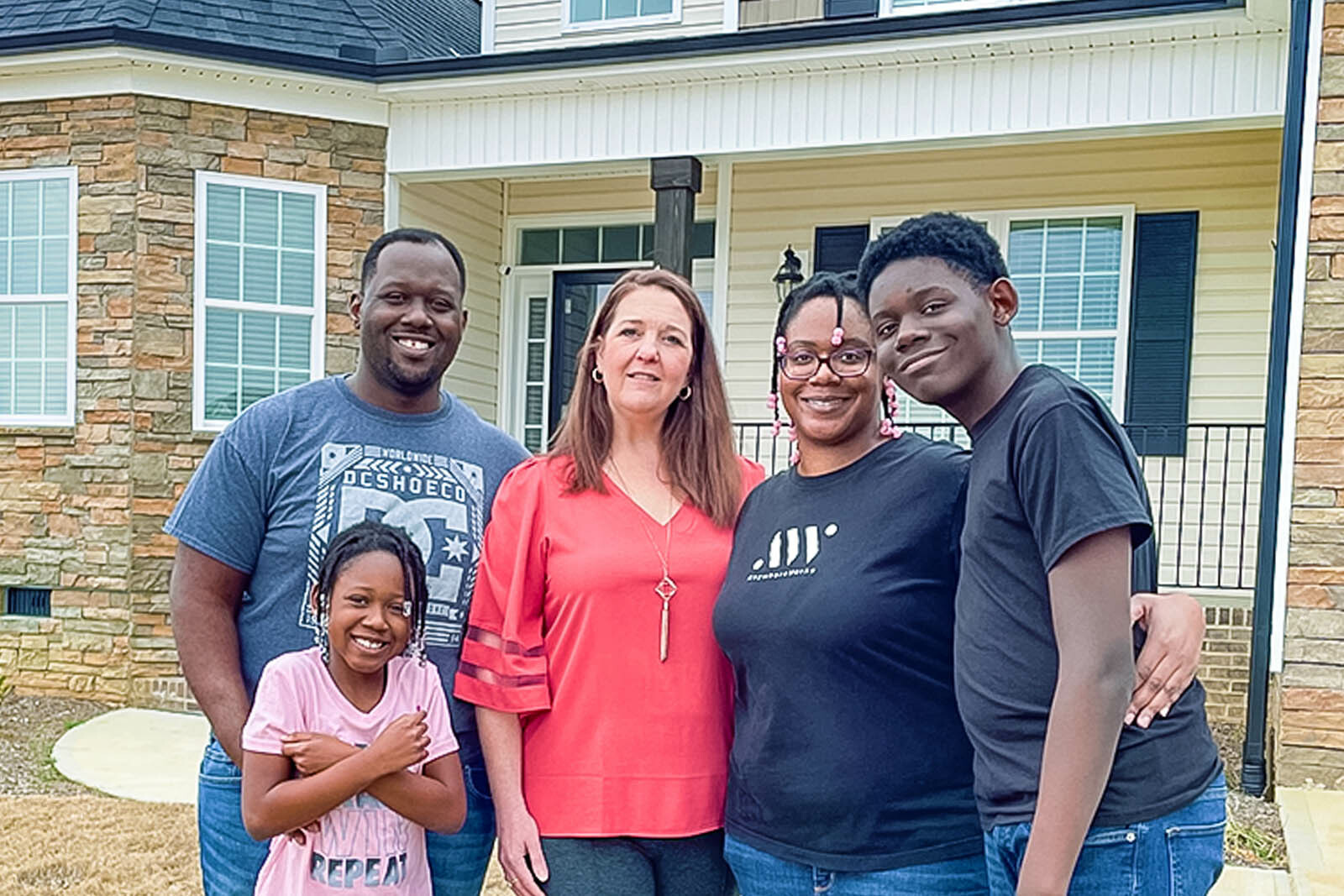 Photo of Demetrius Wood and family with Jennifer Rollins