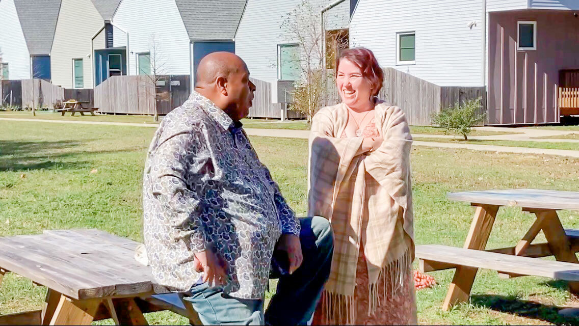 Bastion vets talk at picnic table.