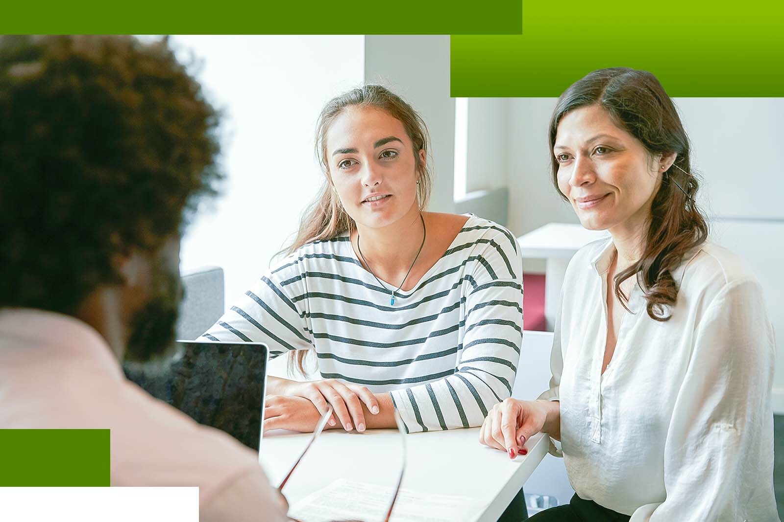 Mother and teenage daughter talking with a financial advisor