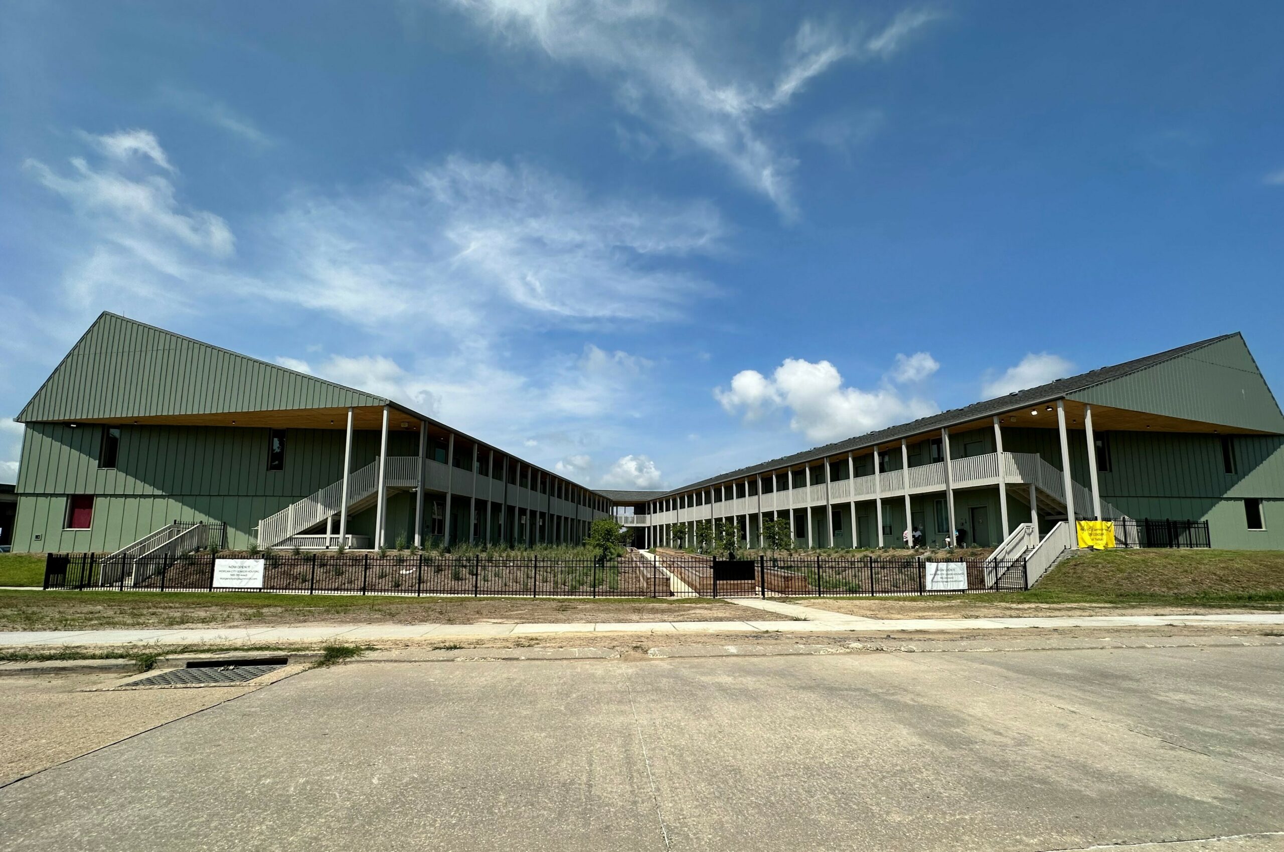 large two level apartment building in a "U" shape