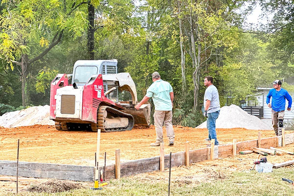 People working on the site of the new build project