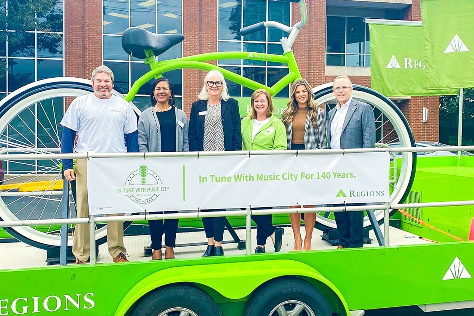 Big Bike and group of associates in front of the...