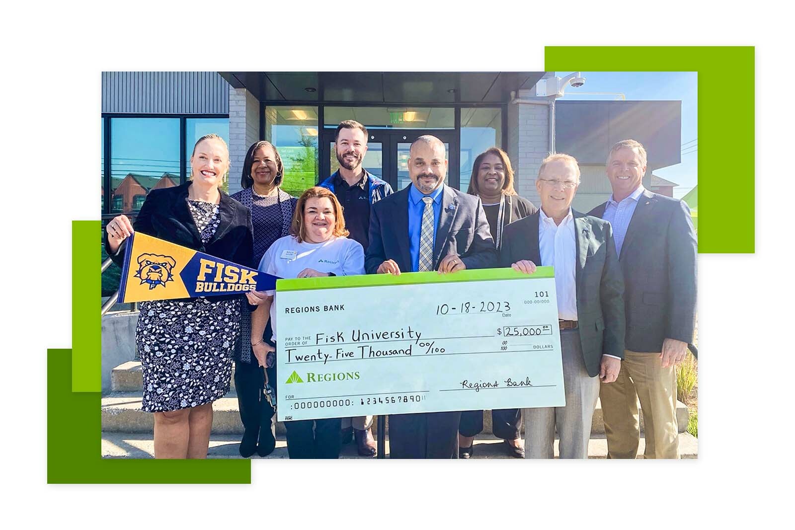 Group of people with the check from Regions Bank