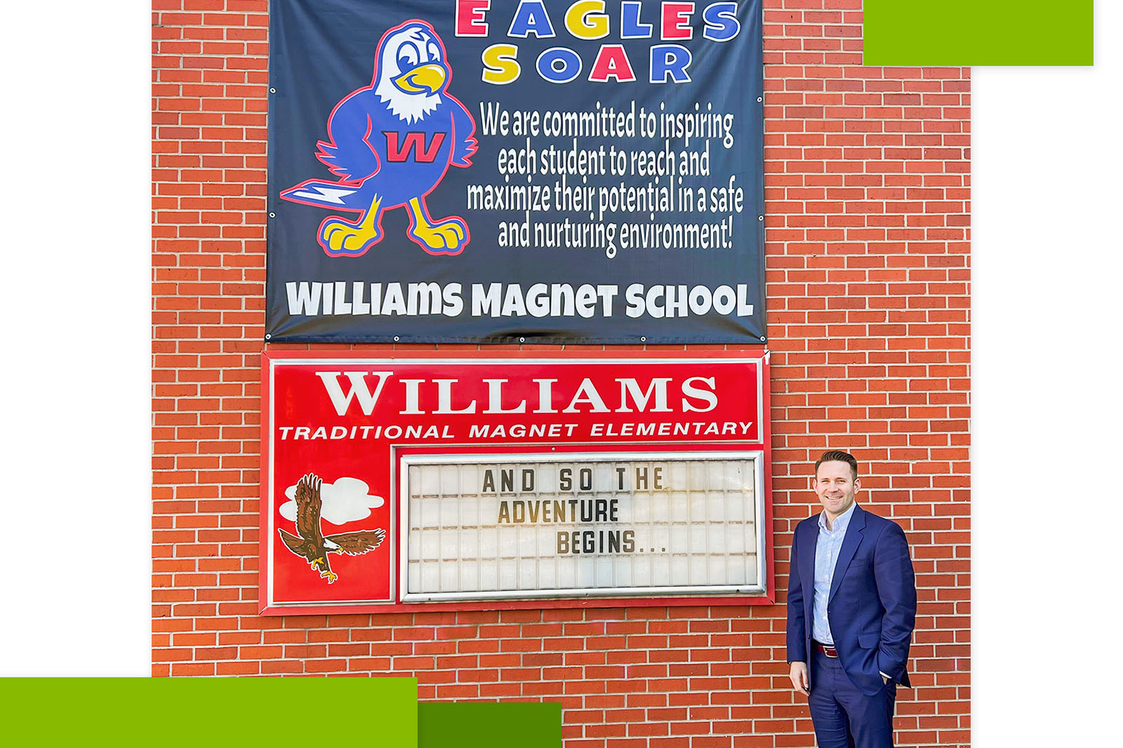 Chance Tharp next to the school sign