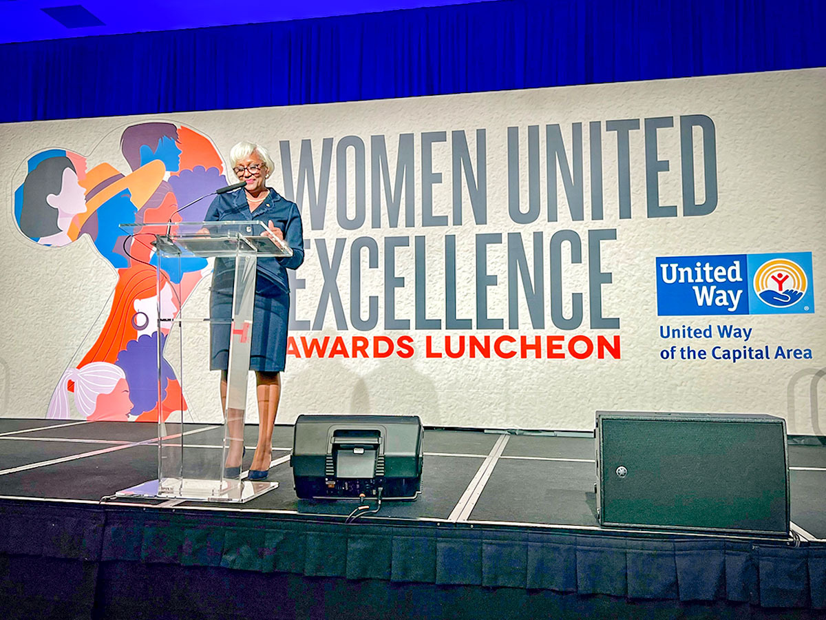 LoRose Moore at a podium.