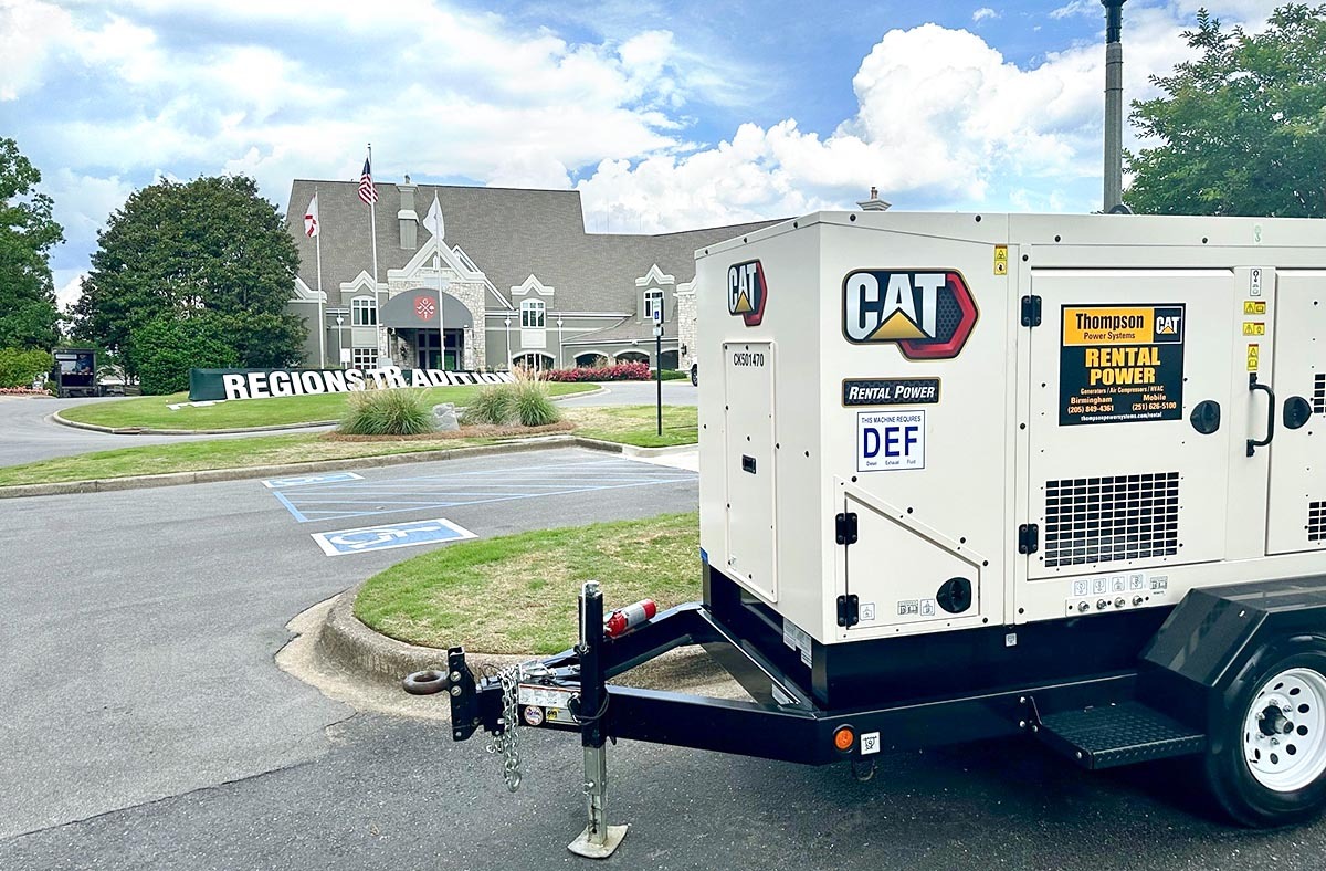 Thompson Tractor machine in front of the Clubhouse