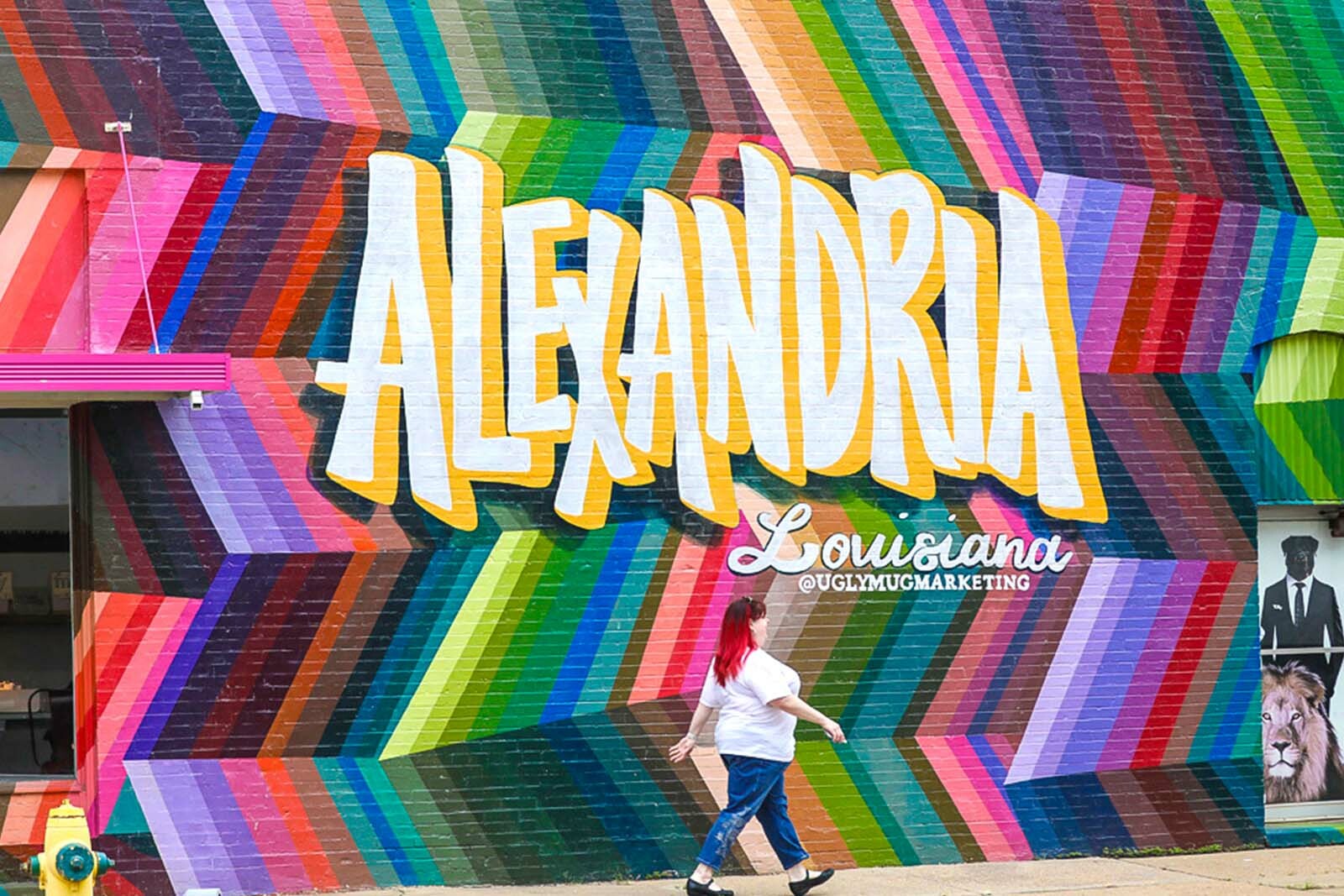 A colorful mural on the side of a building that...