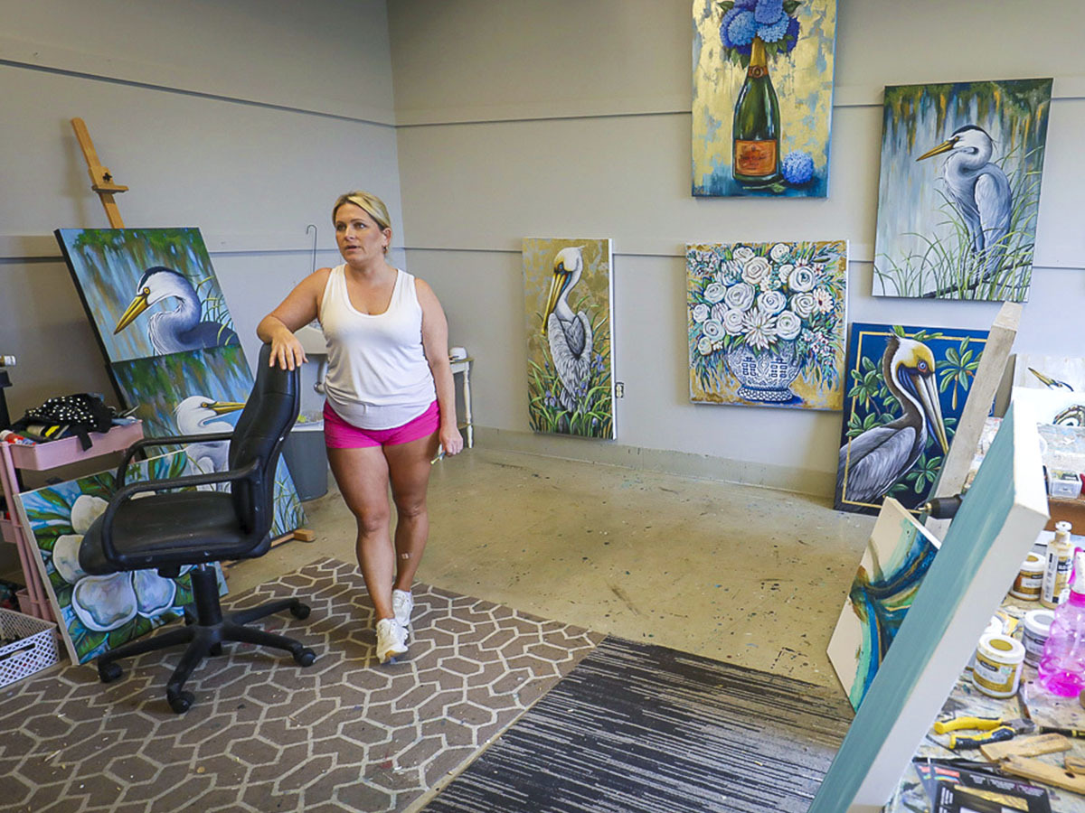 Standing in front of her latest paintings, Leah Morace talks about her art and inspiration inside her studio at River Oaks Art Center.