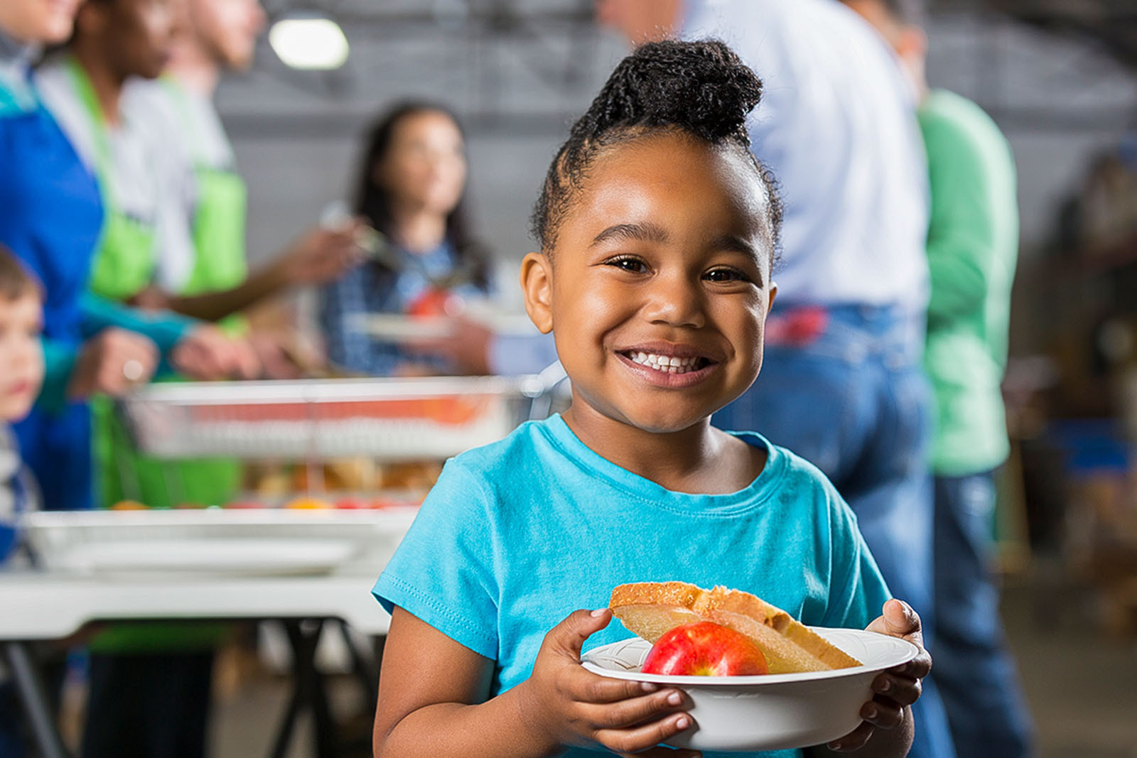 Picture of the child holding a plate
