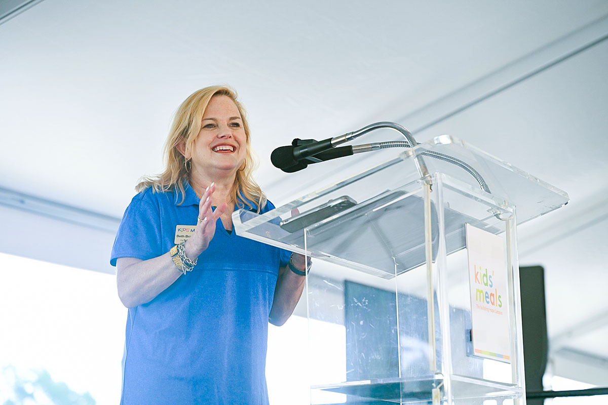 woman speaking at podium