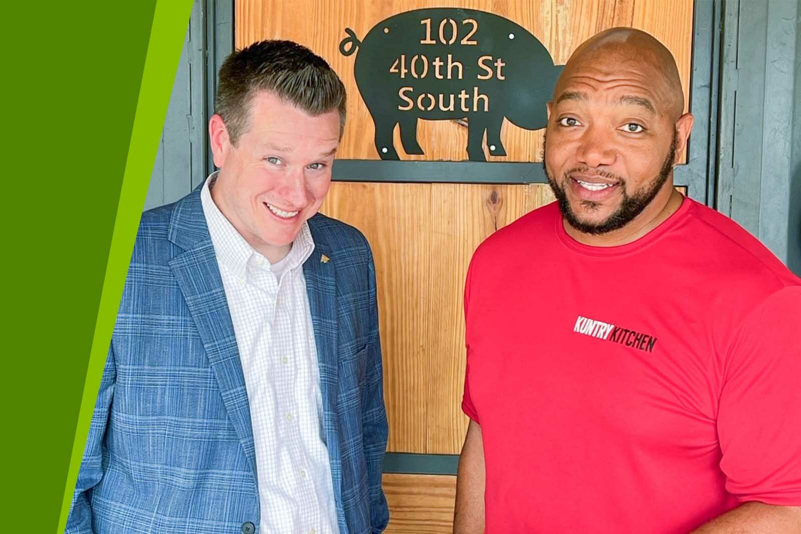 Nick Hayes and DeMarcus Rodgers standing in front of the...