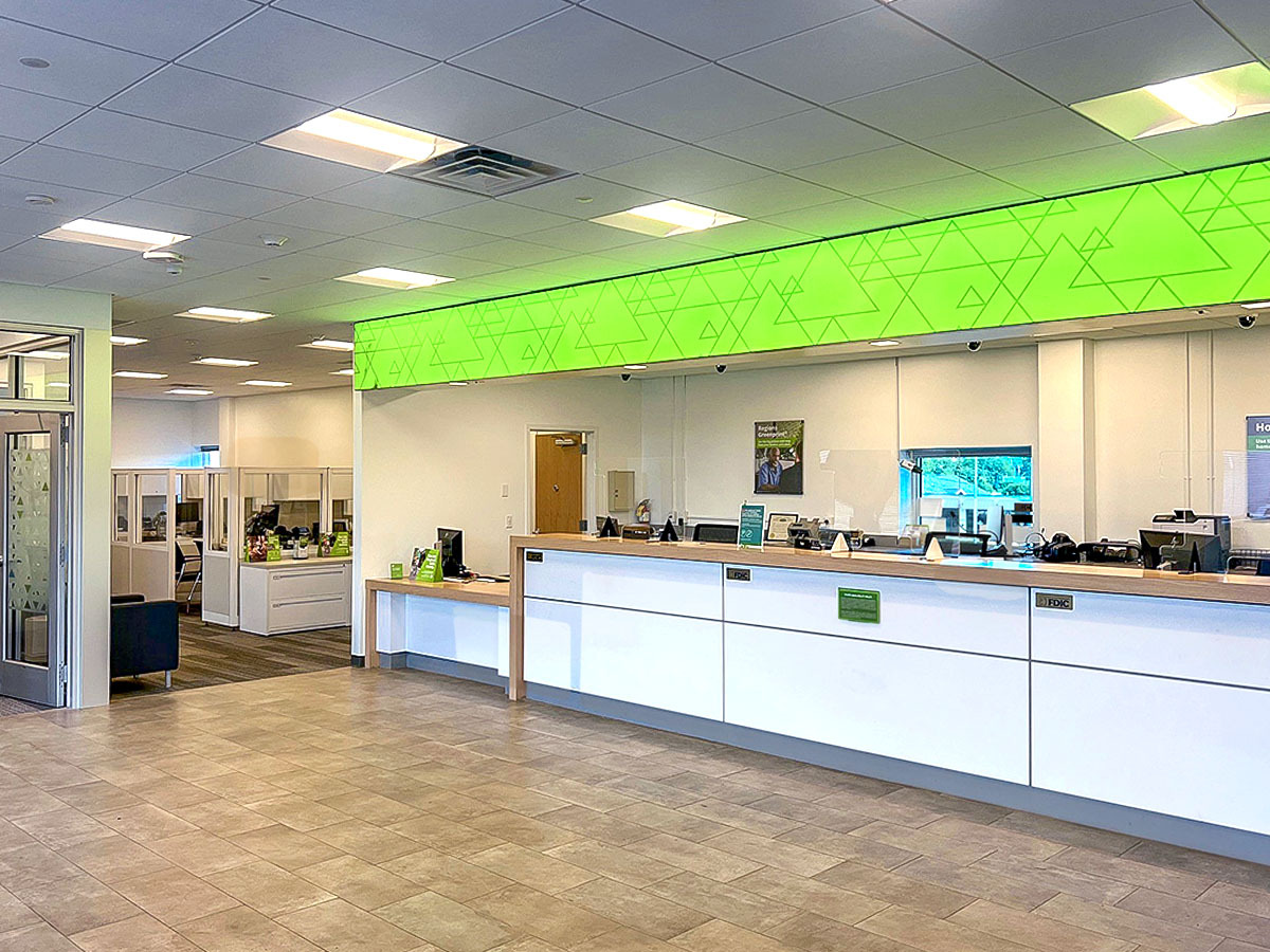 Photo of bank teller and reception area.