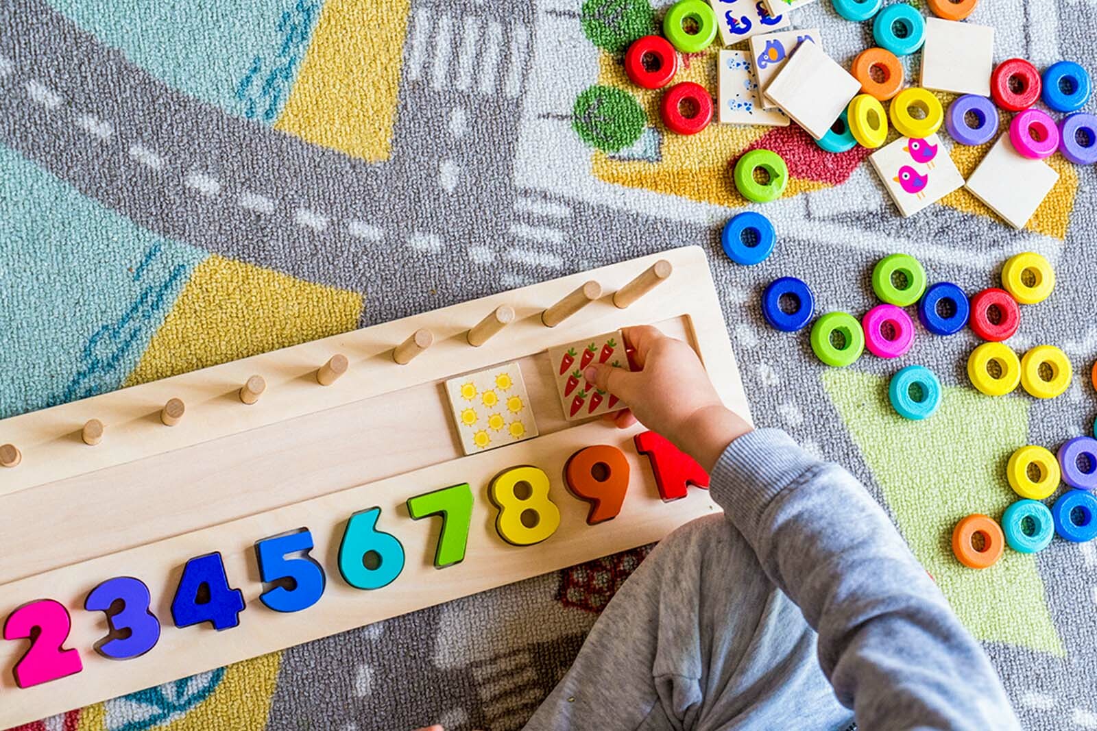 Baby toddler playing Wooden stack and count rainbow colors learning game