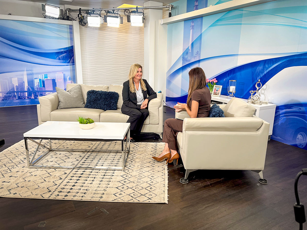 Kelley Brown in television studio.