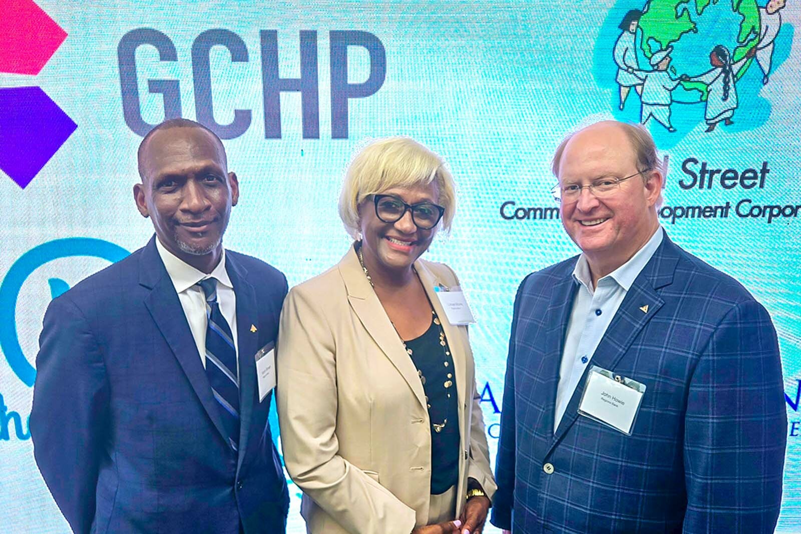 three businesspeople at event