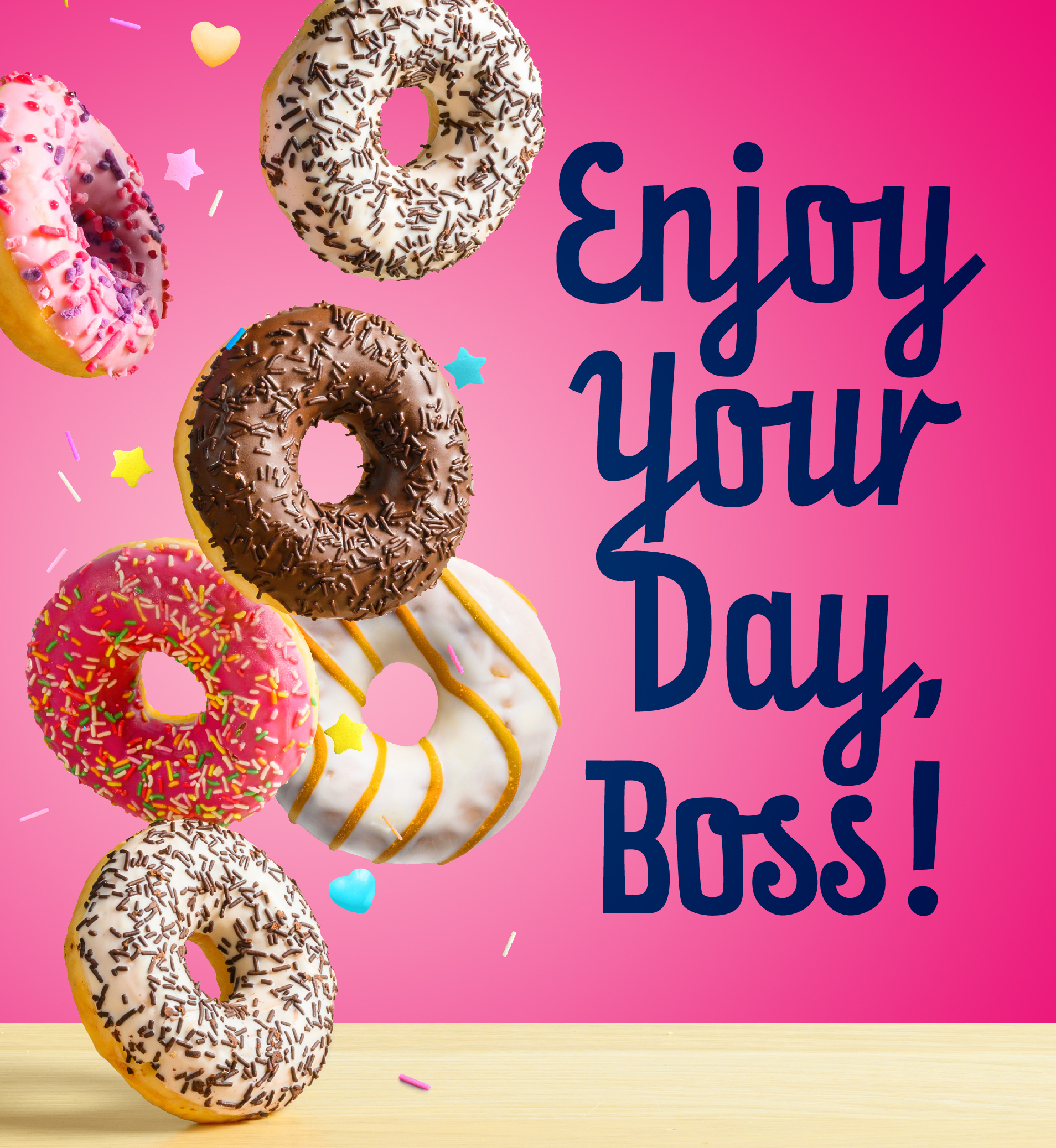 Donuts with sprinkles. Text: Enjoy Your Day, Boss!