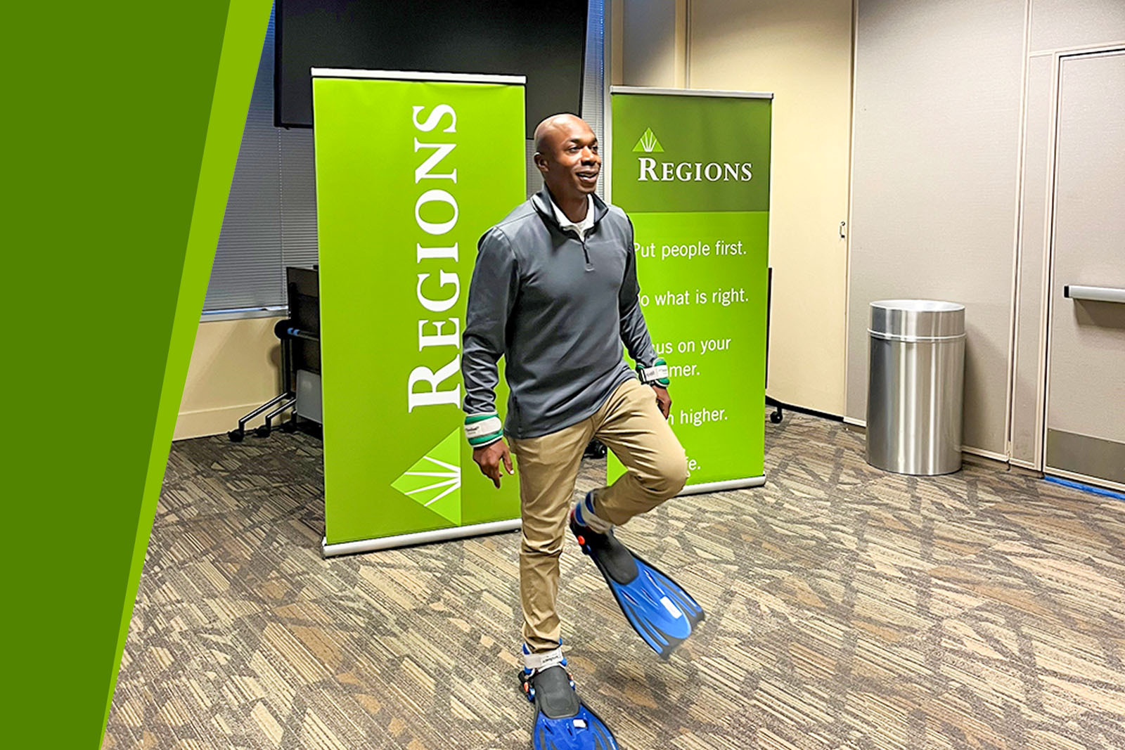 Man trying to walk in flippers and ankle weights.