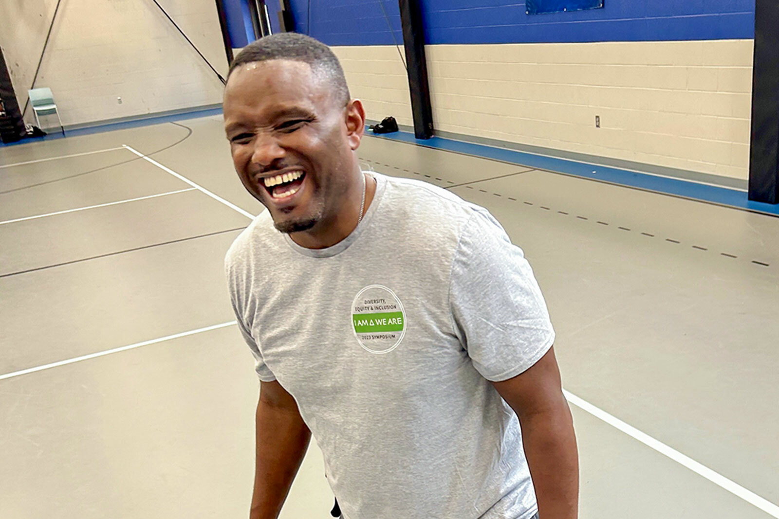 Jimmie Lawrence playing sports with A.G. Boys & Girls Club members.
