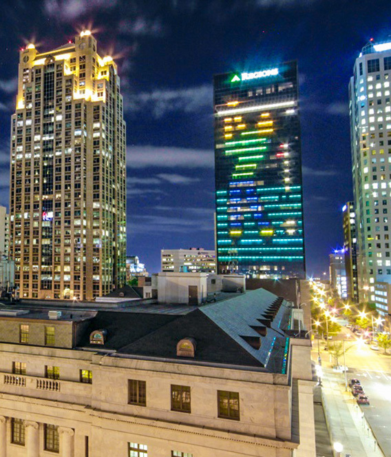 Regions Center lit to resemble a man taking a golf swing.