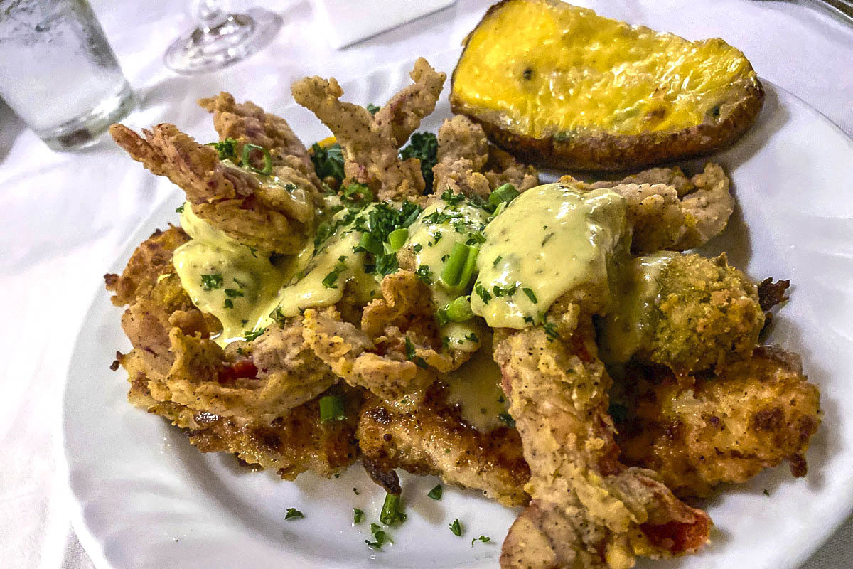 Soft-shelled crayfish over black drum covered in sauce, the special of the day during our visit to Louisiana Lagniappe Restaurant.