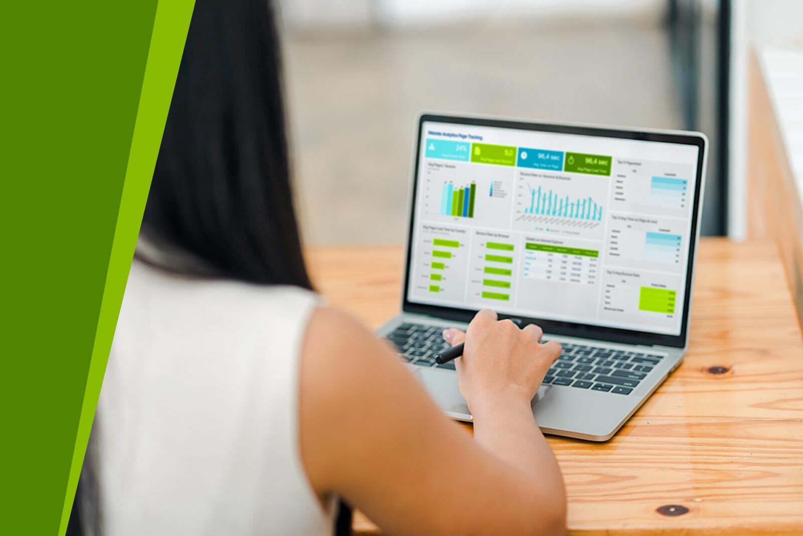 Woman at a computer analyzing data.