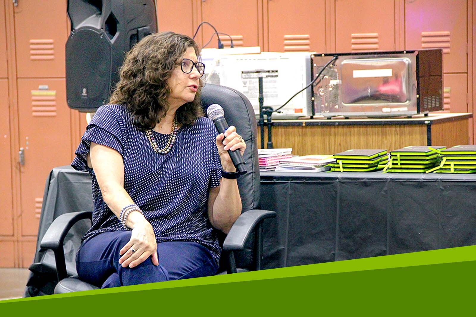 Cheryl Howell speaking at event.