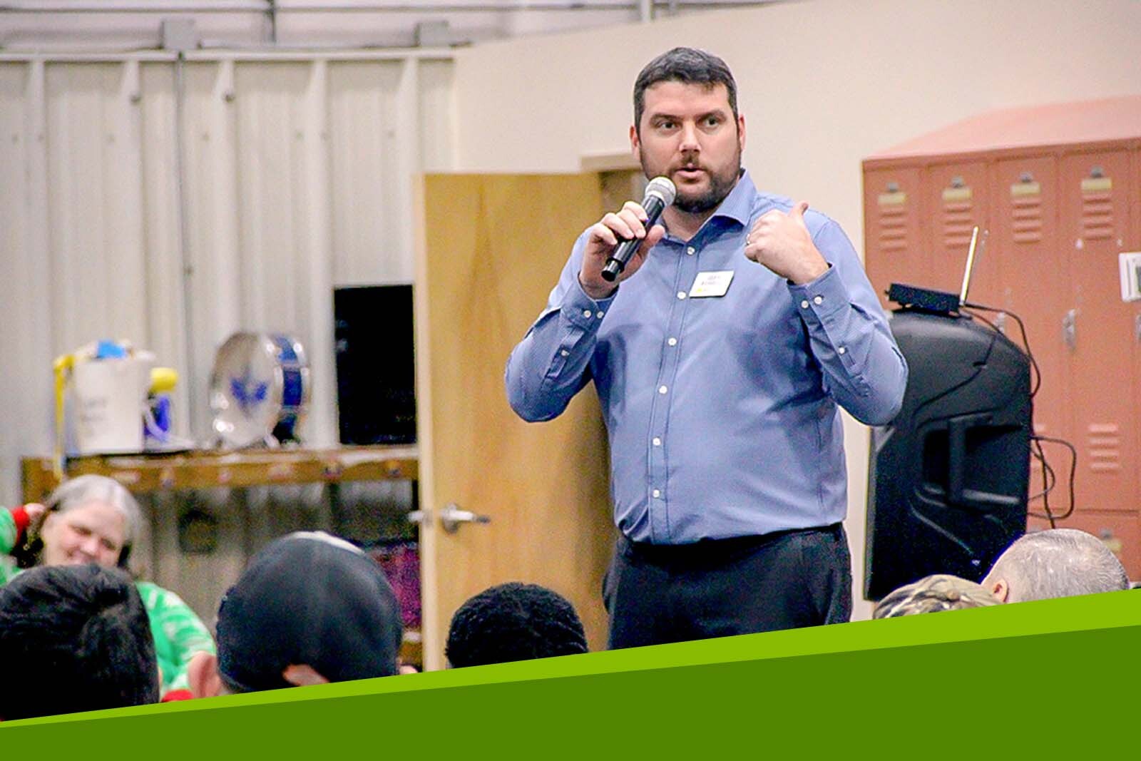 Glen Russell speaking at an event.
