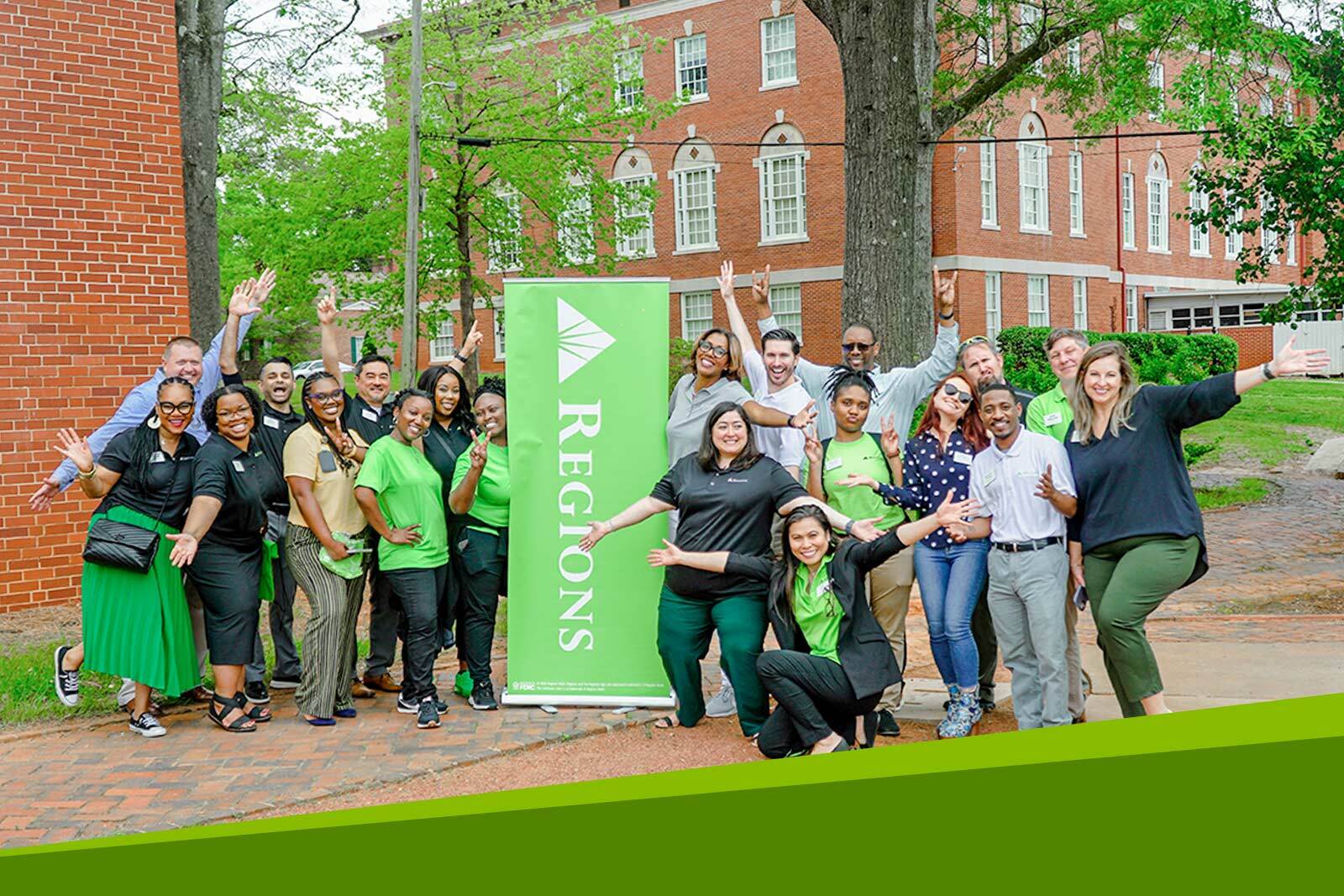 A group of Regions associates posing for a picture at...