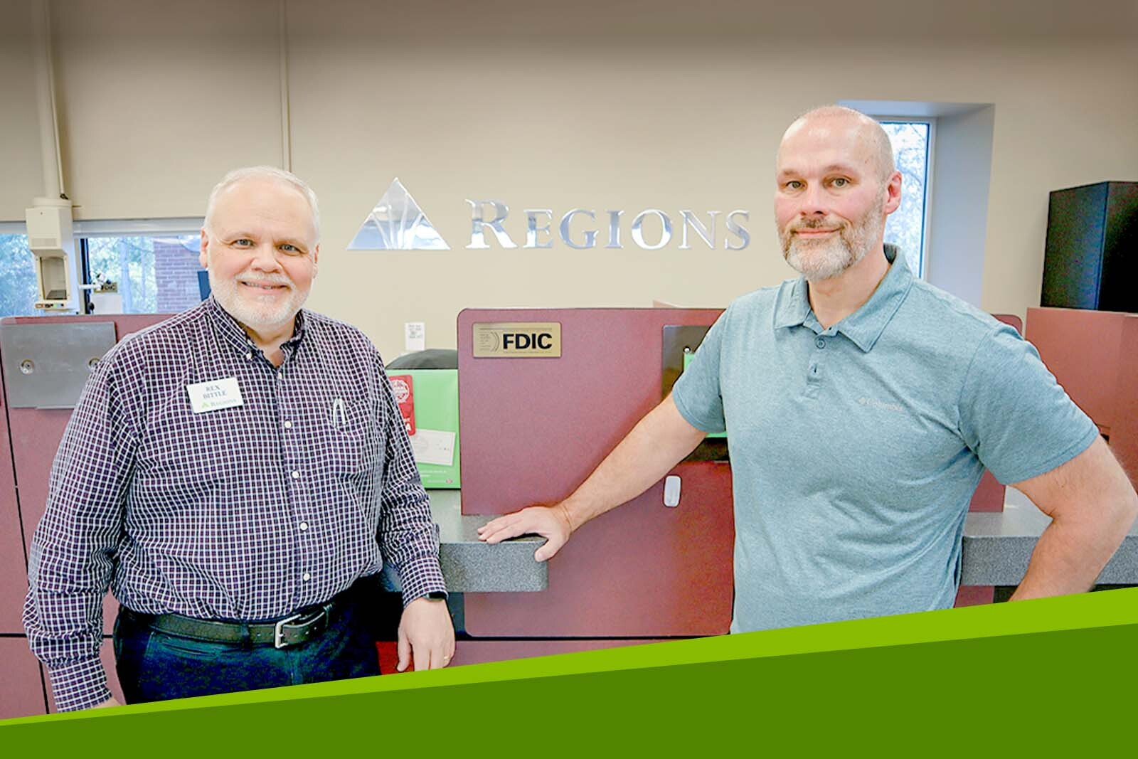 Chuck Odom and Rex Bittle inside a Regions branch.