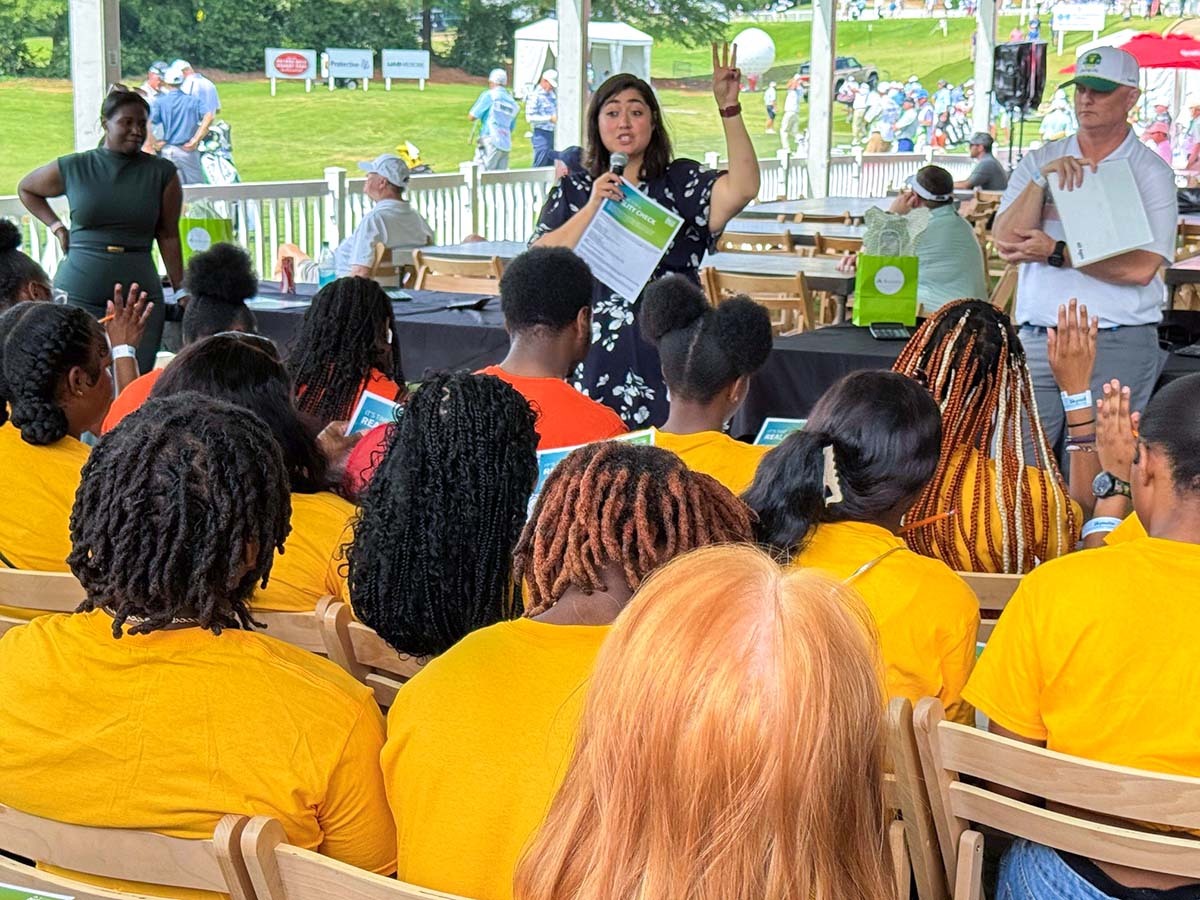 Keren Treme, Regions Financial Education Trainer speaking to Wenonah High students at Regions Tradition Reality Check event.