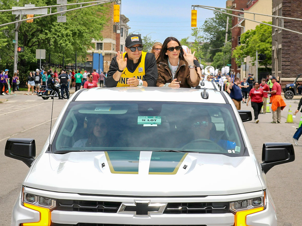 Alex Palou in the back of a truck at the Parade