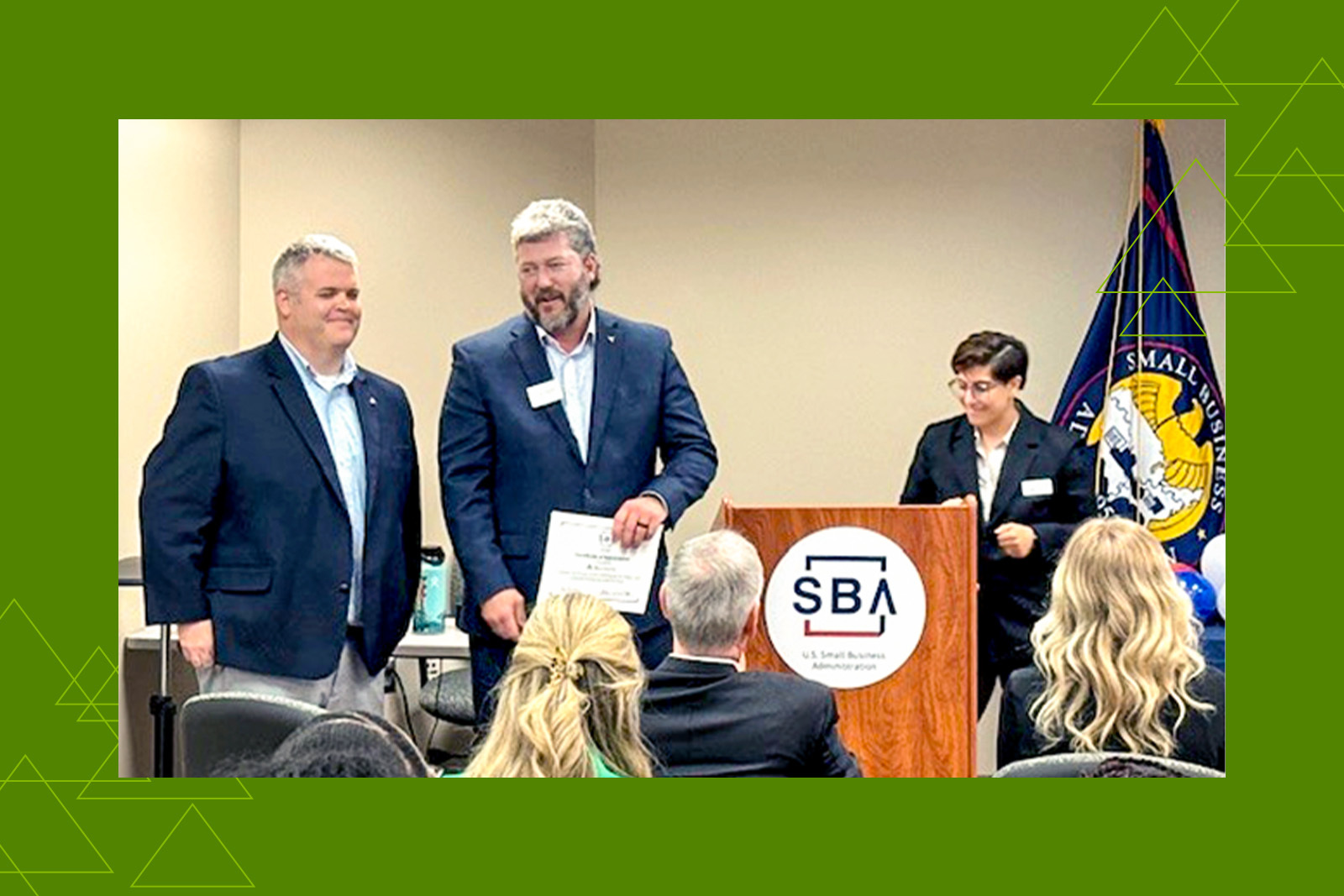 Megyn Rodriguez, Jerry Hammonds, and Jeff Latham standing at a...